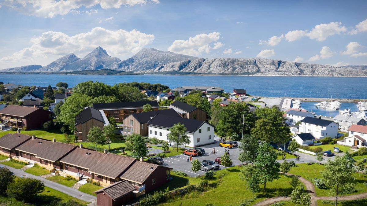Slik skal prosjektet i Sandnessjøen i Alstahaug kommune bli, med prestegården (den hvite bygningen) som dagsenter for hjemmetjenesten og fellesområder for beboerne i de 24 boligene rundt den.