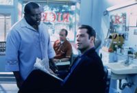 John Travolta som ljusskygg fixare och filmfreak i Get shorty.
