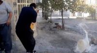 En stillbild från ett av de videoklipp som organisationen Hengaw publicerat från protesterna i kurdiska städer. På bilden träffas en vattendunk av ett skott i Javanrud i västra Iran, enligt Hengaw.