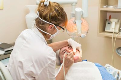 older man in dentist in a dental surgery. Healthcare, medicine.
