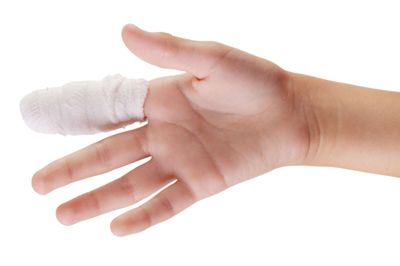 Hand with bandaged finger on a white background