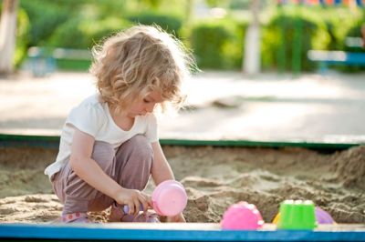 Child on playground in summer park