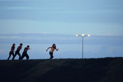 Friends running at sunset.