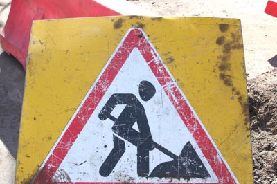 Old road sign roadwork close up.