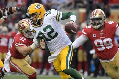 Quarterback Aaron Rodgers (12) har kontrakt med Green Bay Packers for de næste fire sæsoner, og han håber at spille i klubben karrieren ud. (Arkivfoto)