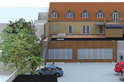 Sådan kommer ejendommen Østergade 42-44 til at se ud set fra Danmarksgades parkeringsplads. Arbejdernes Landsbank har fået ny facade i baggården - og på bagbygningens flade tag anlægges en tagterrasse på godt 100 kvadratmeter til brug for kommende lejere af ny luksuslejlighed. Illustrtion: ReTo Invest Herning ApS