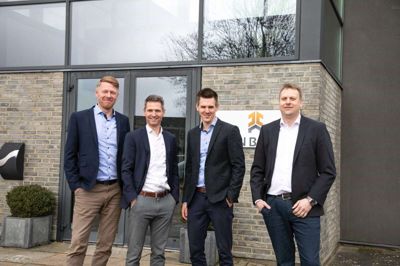 De tre nye mand i ledelsen står her sammen med direktøren. Fra venstre er det Klaus Kallesøe, Torben Baden, Jeppe Jørgensen og Flemming V.T. Rasmussen. Foto: PR-foto
