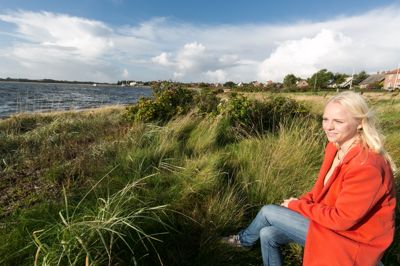 Signe Munk varsler en ny tids klassekamp mellem provinsen og hovedstaden. Hun er selv den eneste minister i regeringen, der bor vest for Storebælt.