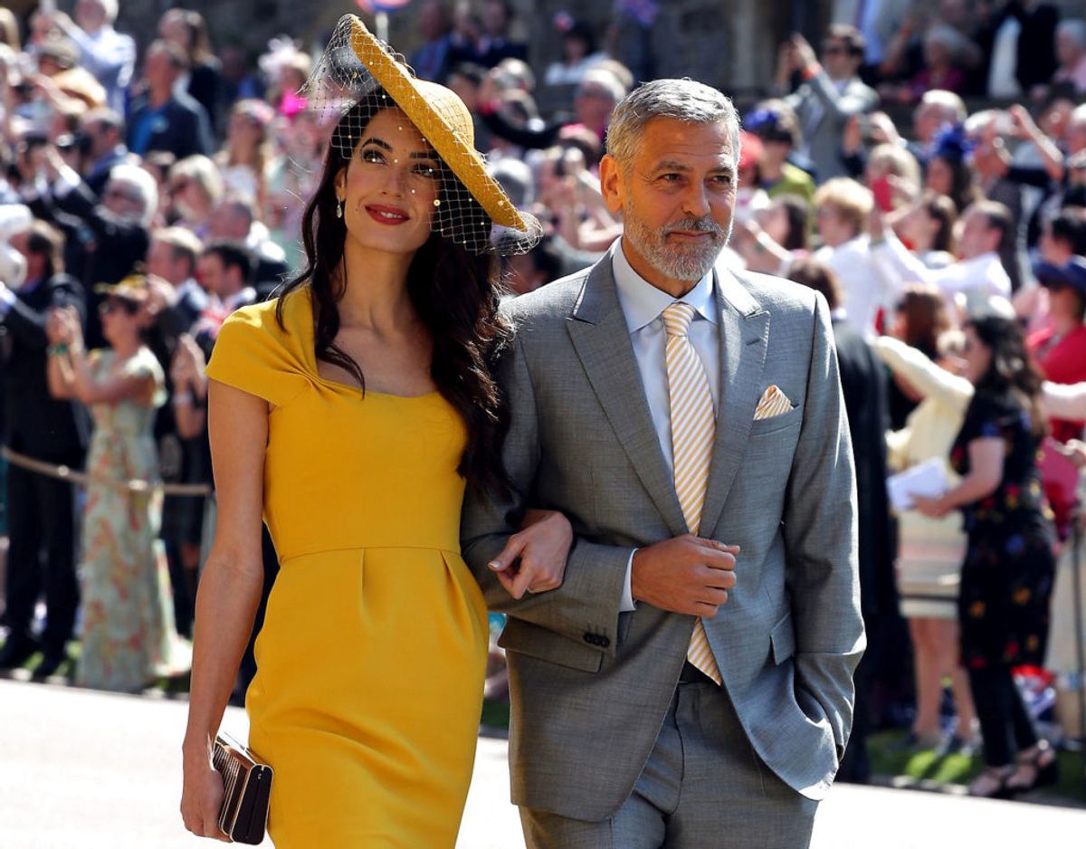 George og Amal Clooney var blandt de mange, der deltog i vielsen af prins Harry og Meghan Markle i maj sidste år. Foto: Scanpix