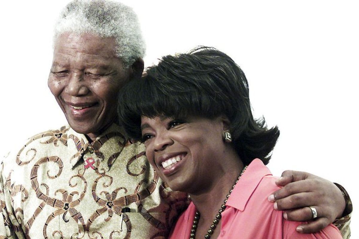 Her ses Nelson Mandela sammen med Oprah Winfrey tilbage i 2002. Arkivfoto: Juda Ngwenya/Scanpix
