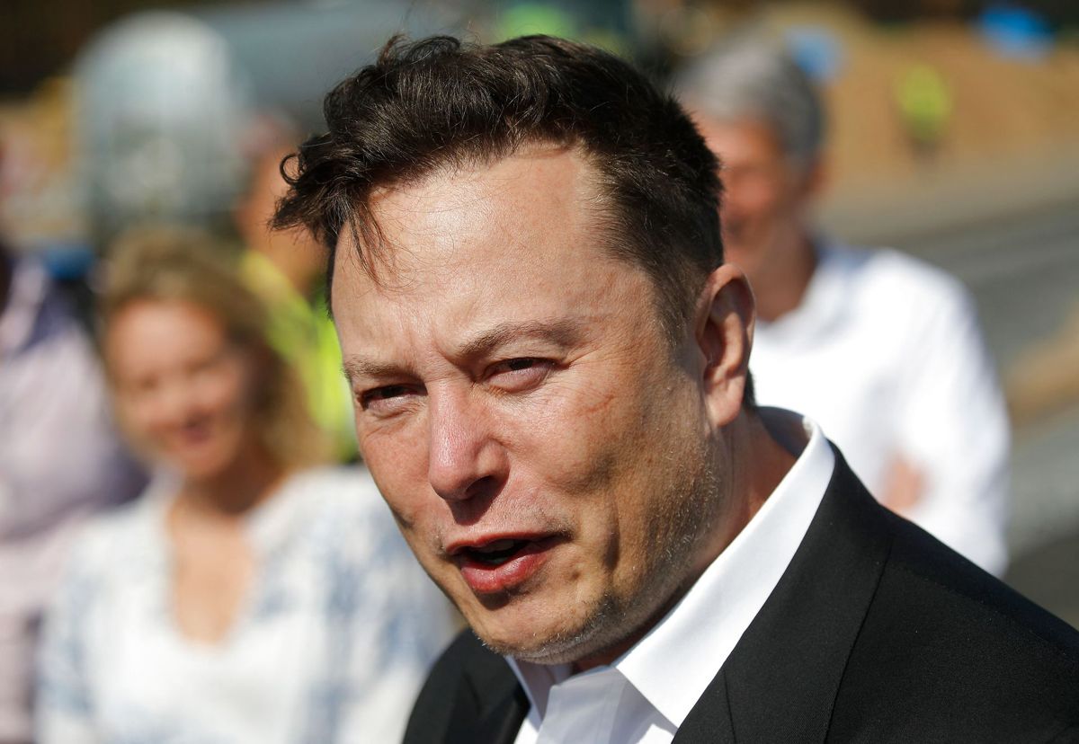 (FILES) In this file photo taken on September 3, 2020 Tesla CEO Elon Musk talks to media as he arrives to visit the construction site of the future US electric car giant Tesla, in Gruenheide near Berlin. - The court battle between Elon Musk and Twitter kicked off on July 19, 2022, as the social media firm tries to force the entrepreneur to honor their $44 billion buyout deal. The first hearing will center on Twitter's push to set a trial date for as early as September in a case that has massive stakes for both parties. (Photo by Odd ANDERSEN / AFP)